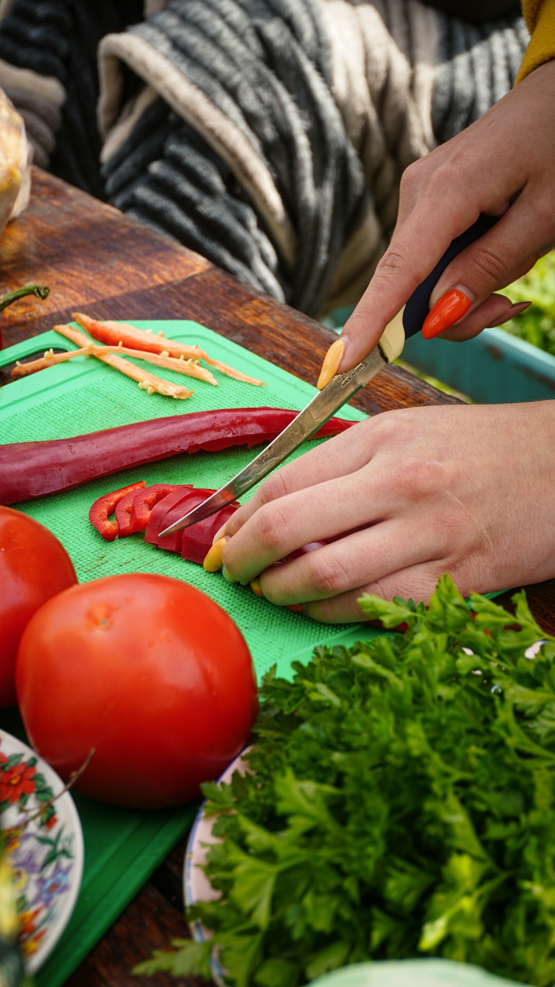 woman chopping fresh vegetables
